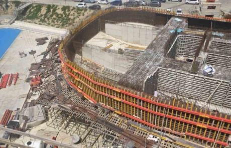 08_aerial_progress_curved_shell_2026-04